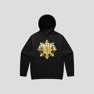 Black hoodie with gold sun design and 'Rooted' text on a gray background