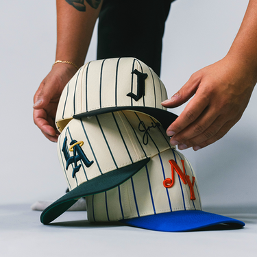 "J" Signature Pinstripe Snapback Hat (CREAM/BLACK)